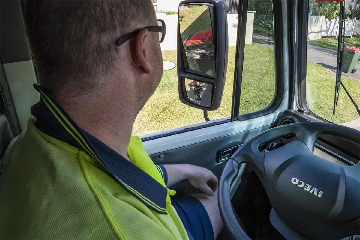 Image of waste driver in truck