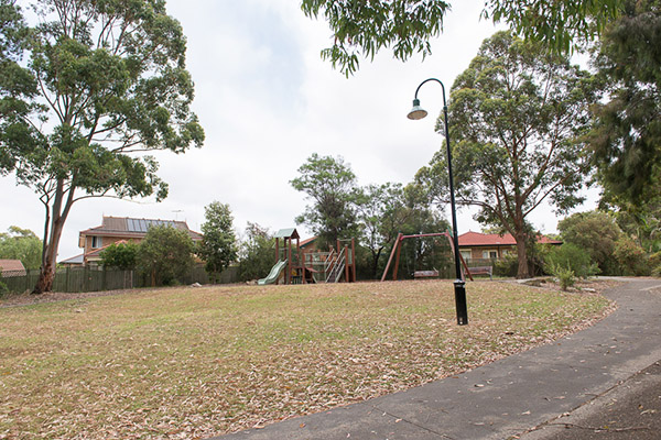Grassed open space with playground