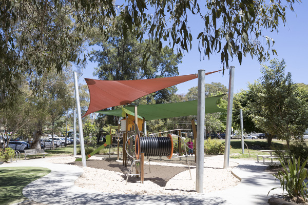 Playground with shade sail and sand softfall
