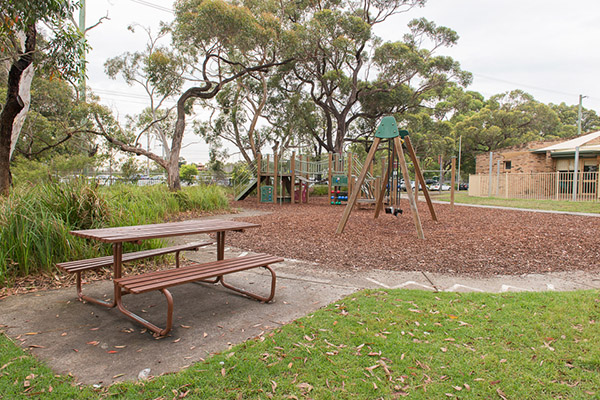 Playground with seating and bark softfall
