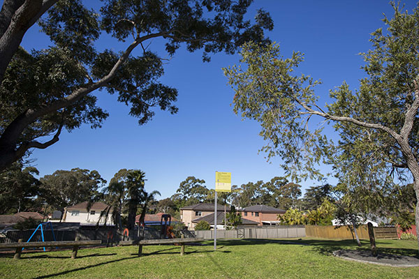 Park with playground, grass and trees