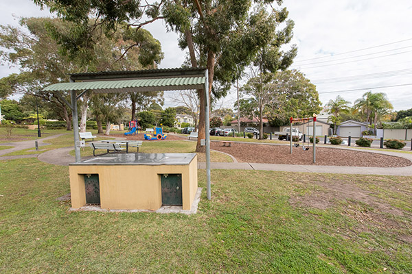 BBQ shelter and seating at playground