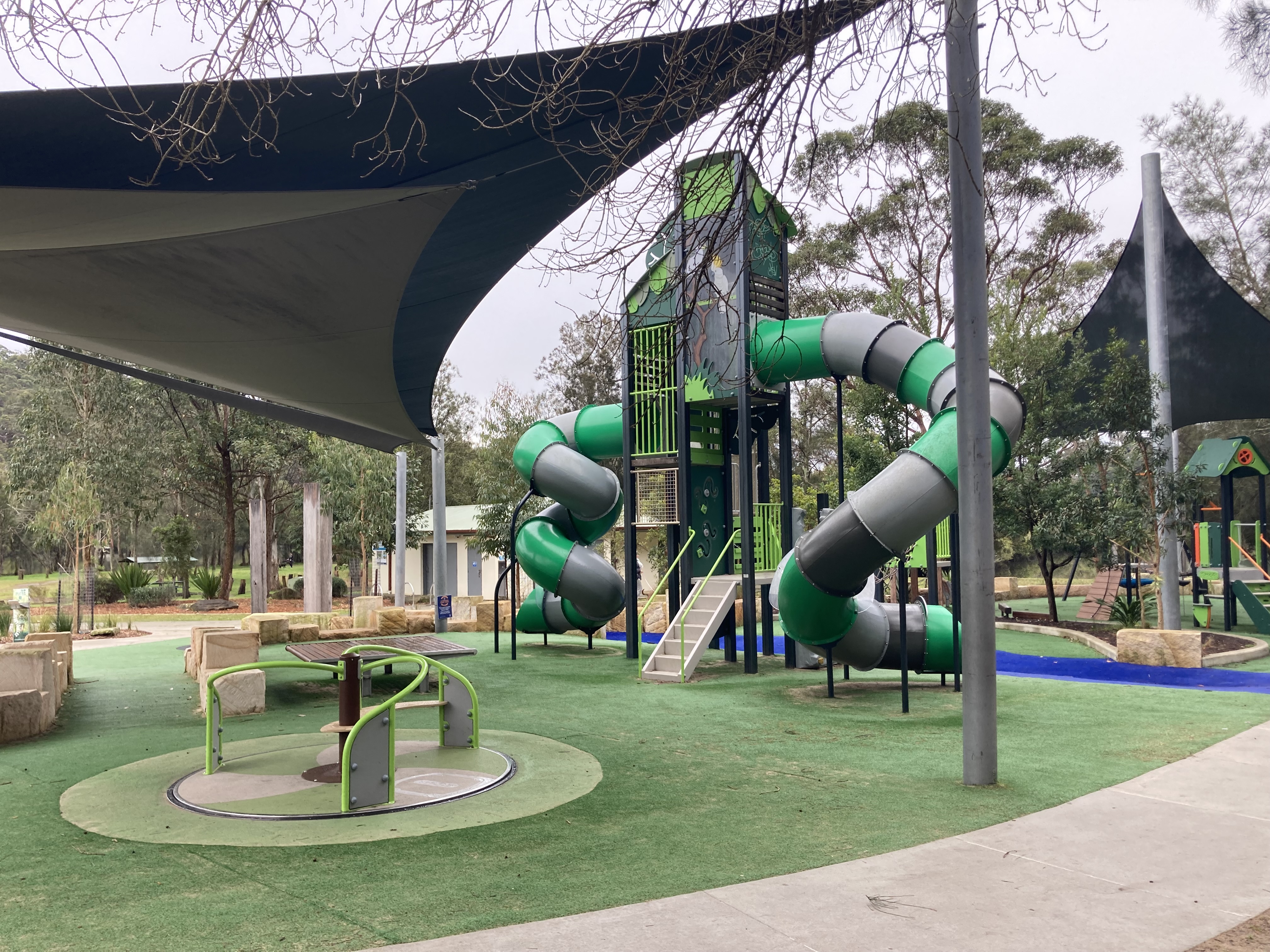 Playground with climbing tower in bushland reserve
