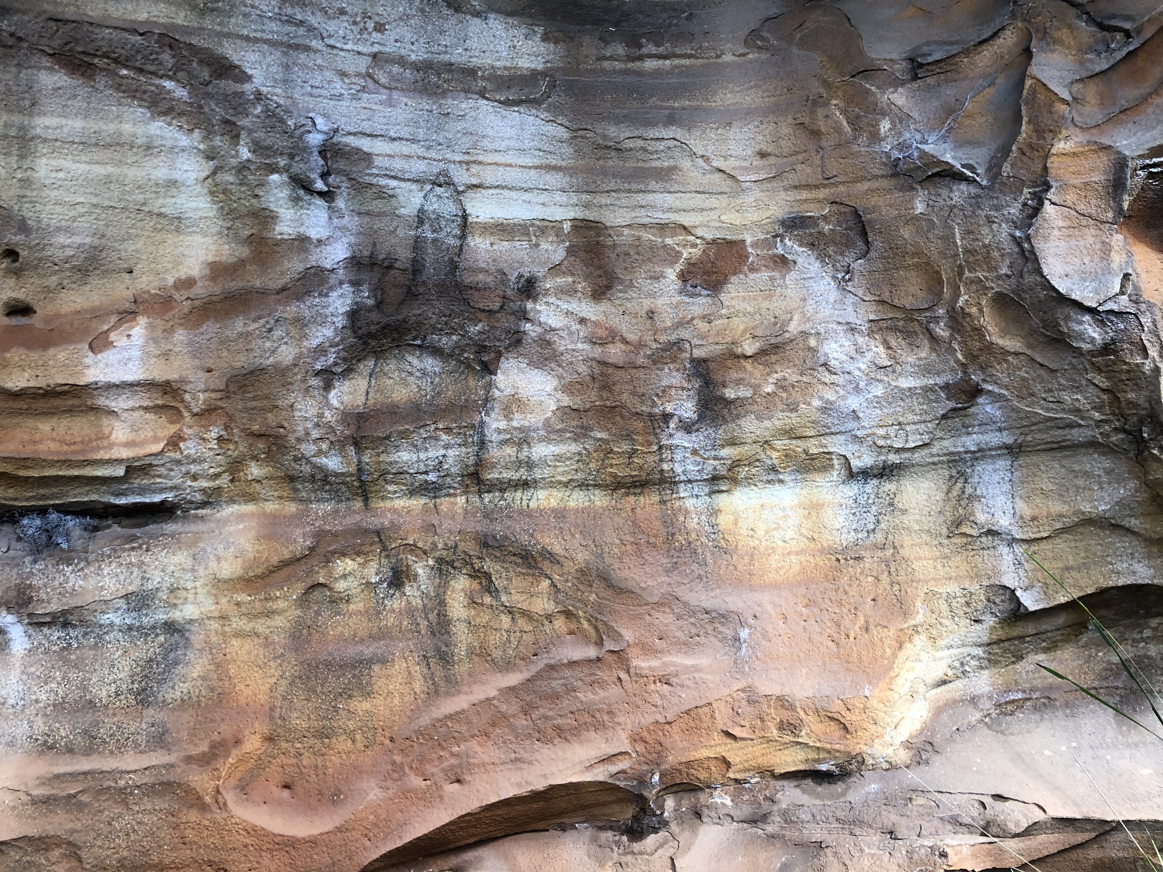 Aboriginal artwork on rock face 