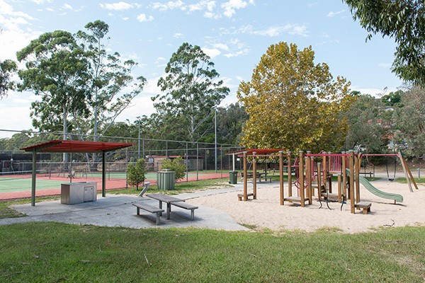 Playground with BBQ and picnic seating