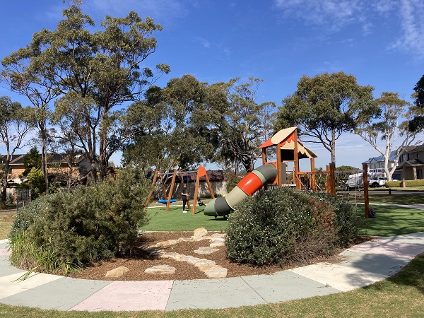 Playground with activity panels and swings
