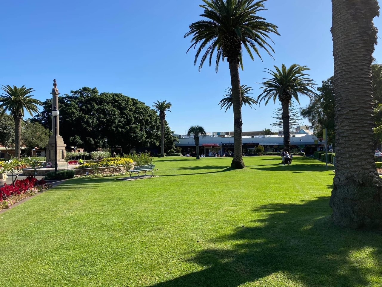 Monro Park in Cronulla, war memorial in foreground and lush green gardens in the background