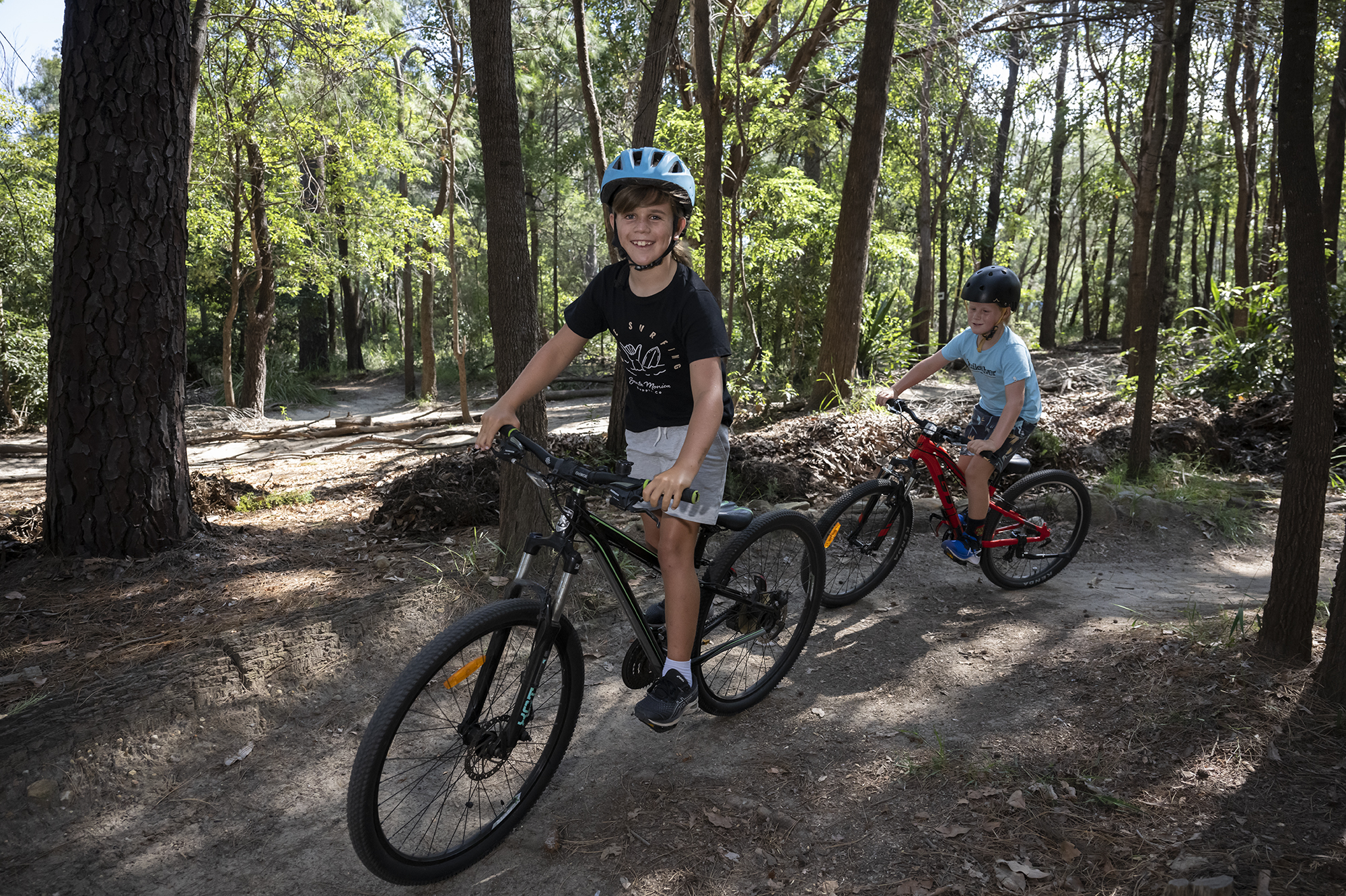 Boys riding bikes in Waratah Park