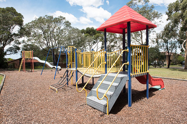 Playground with slides and climbing fort