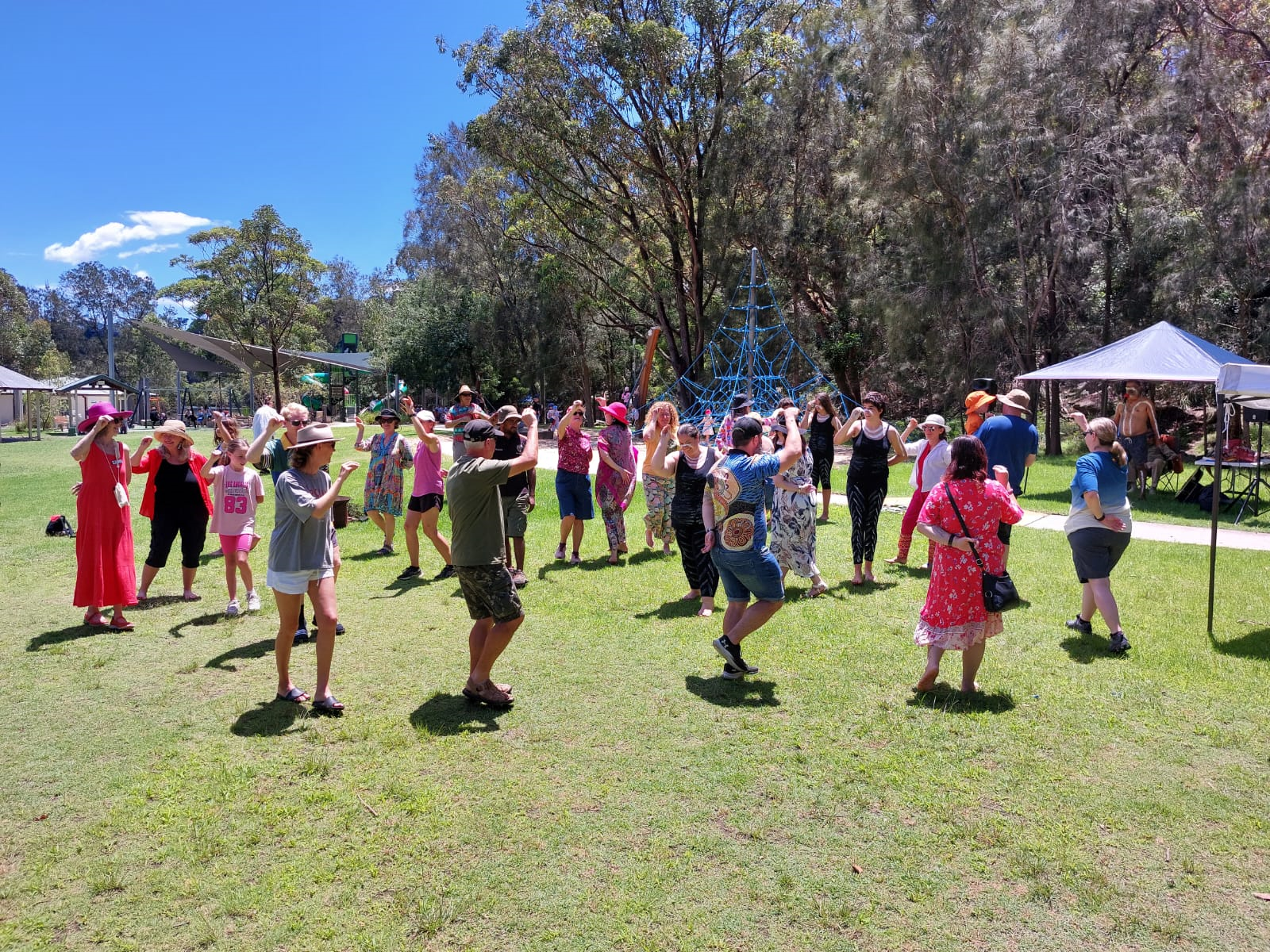 Group dancing together at previous Reconciliation Day Picnic