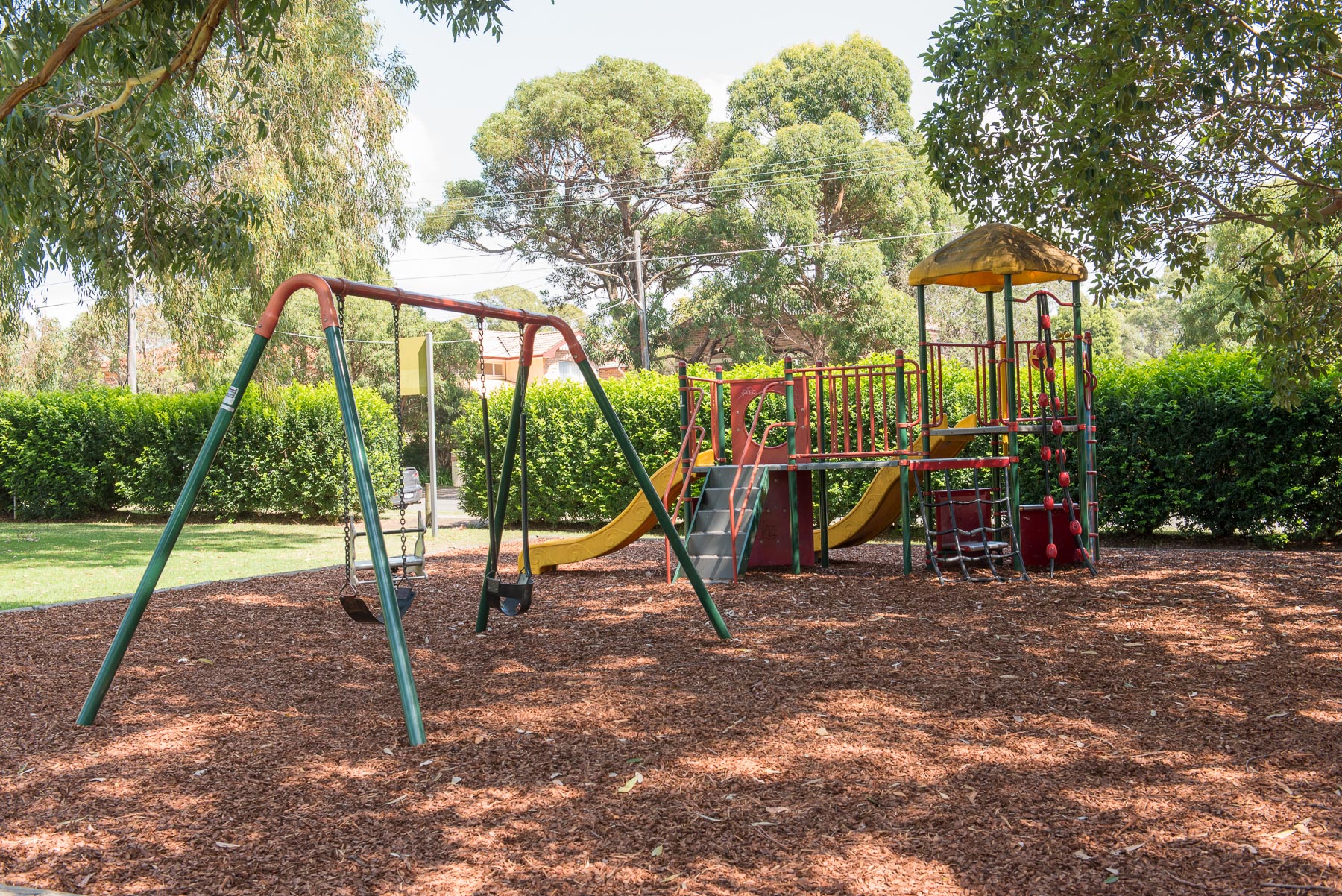 Leafy park with playground