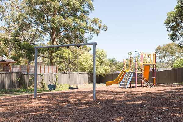 Playground with swings, slide and climbing equipment