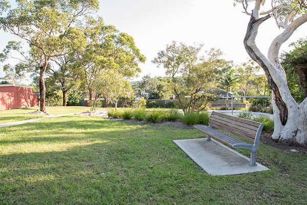 Leafy reserve with seating and play equipment