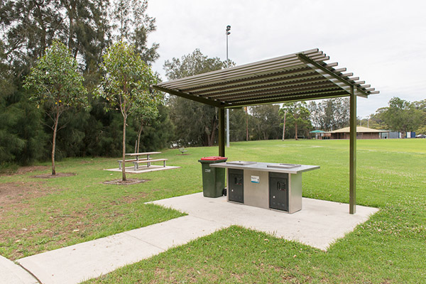 BBQ shelter in park with seating