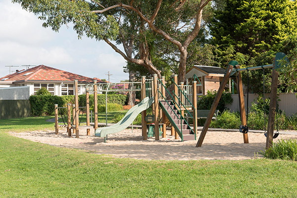 Playground with slide, monkey bars and swings