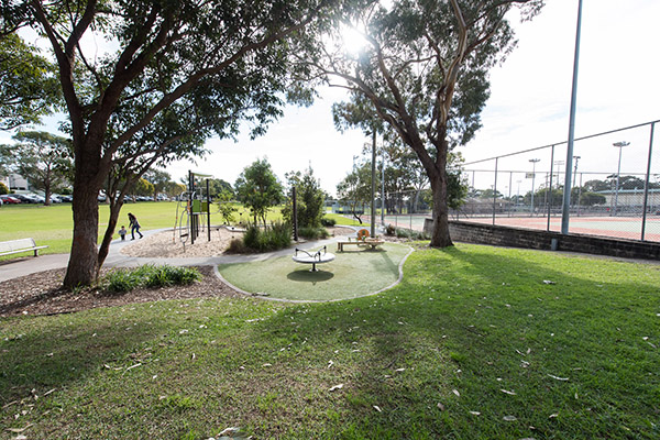 Playground, tennis courts and seating