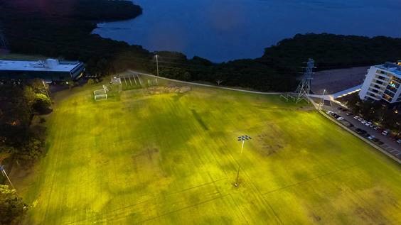 Floodlit playing field at night