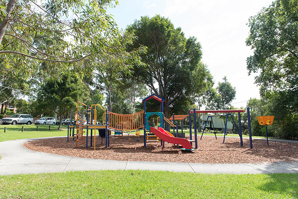 Playground with climbing equipment and swings