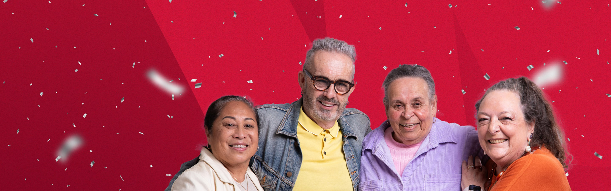 Older people smiling on a red background