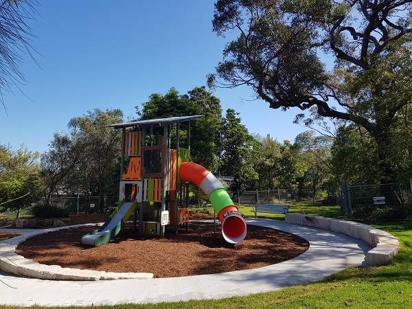 Playground with climbing tower and slide