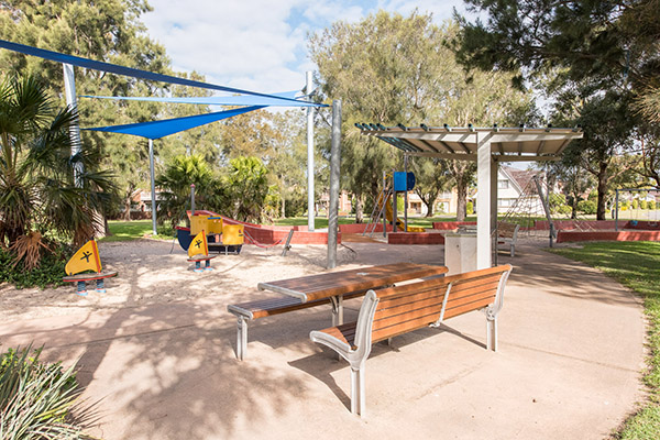 Playground with shade sail and seating