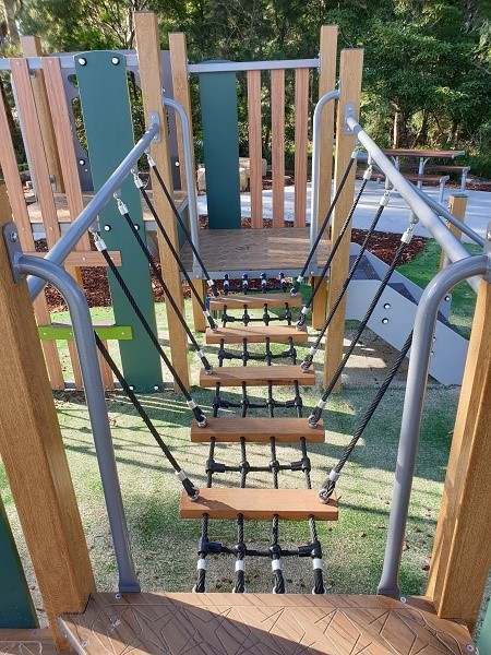 Play equipment with rope ladder