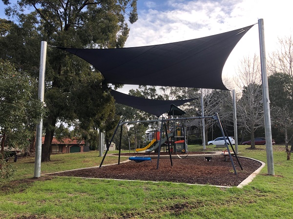 Playground with basket swing, slides and climbing equipment