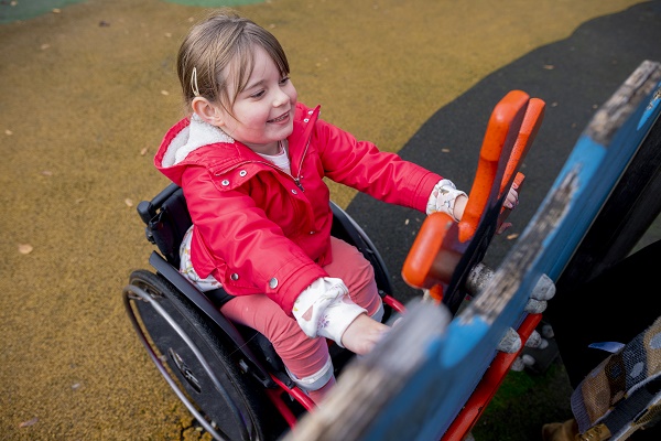 Child in wheelchair playing