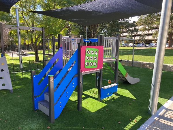 Playground climbing fort with shade sail