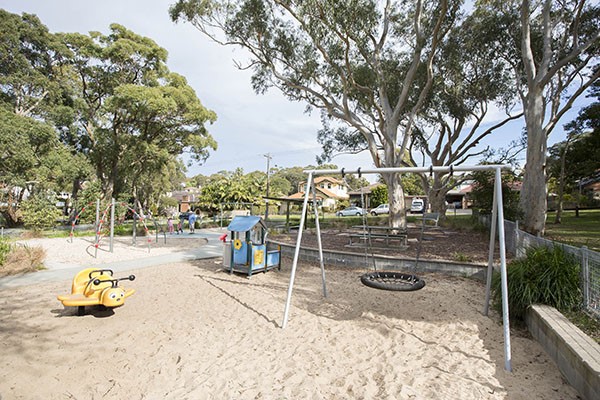 Playground with sand softfall and basket swing