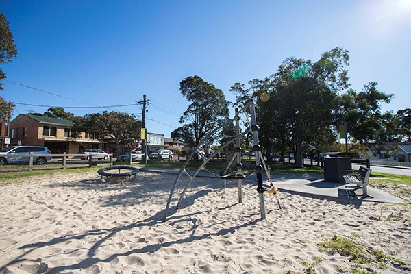 Sandy playground with seating
