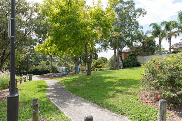 View of Reserve with mature trees and playground