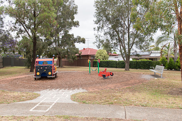 Playground with play truck, toddler swing and rocker