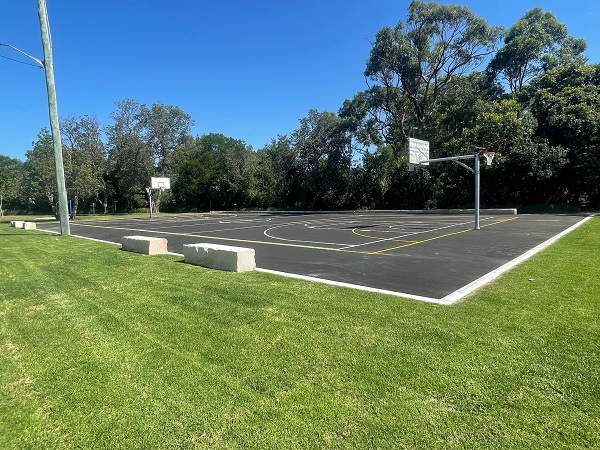 Basketball courts in leafy reserve